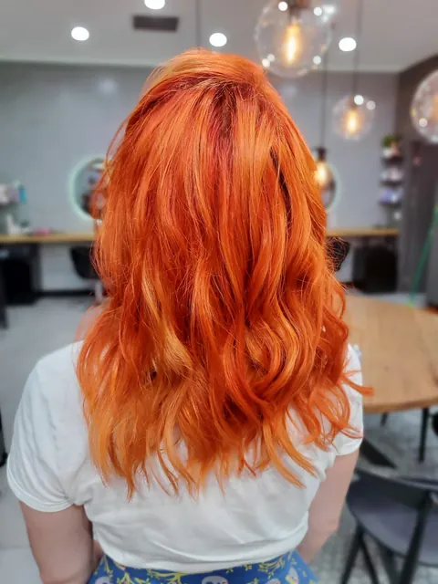 Vivid copper orange colour with soft waves